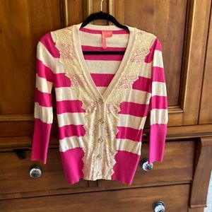 Hot pink and cream cardigan with lace detail and gold buttons! Size medium!